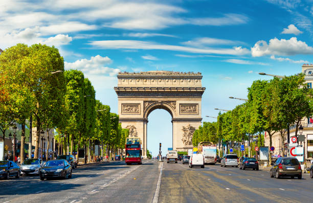 Arc de Triomphe in France Road of Champs Elysee leading to Arc de Triomphe in Paris, France avenue des champs elysees photos stock pictures, royalty-free photos & images