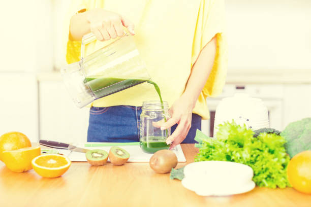 istock Preparing detox fruits smoothie in blender 1278240379