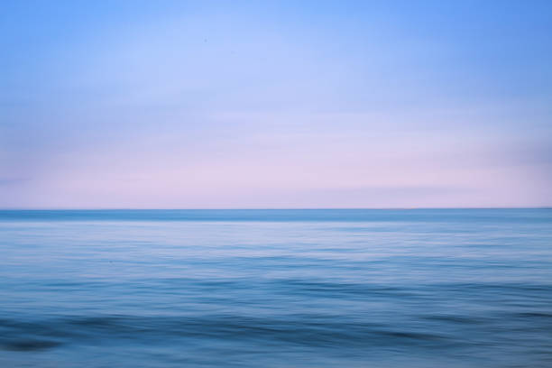 istock blurred pink seascape at sunset 1278240395