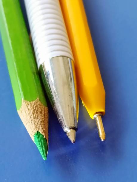 istock Pencil and pen on blue background 1278240972
