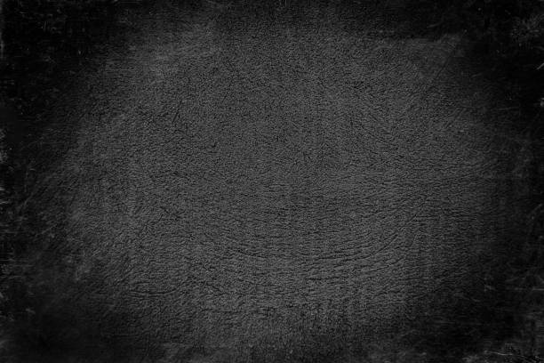 istock Cement old wall plaster in black and gray with a damaged surface covered with scratches, cracks and grains. 1278242671