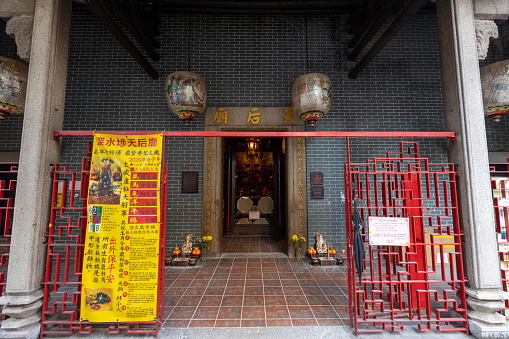 Tin Hau Temple in Sham Shui Po, Kowloon, Hong Kong. Sham Shui Po was formerly a bay where many fishing junks berthed. The fishing folks looked to the supernatural power to keep them safe on the sea and built this temple in honor of Tin Hau, the God-dess of the Sea in 1901.