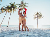 Couple on tropical beach at Christmas