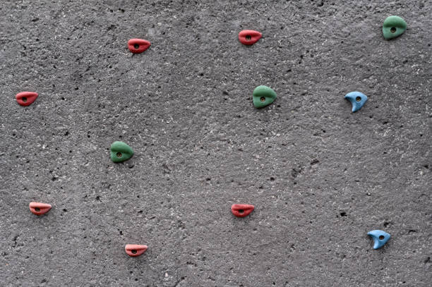 istock Rock climbing concert wall with many colorful holds 1278244229