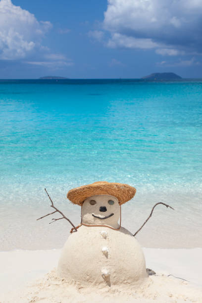 istock Snowman with straw hat on tropical beach in the Caribbean 1278245394