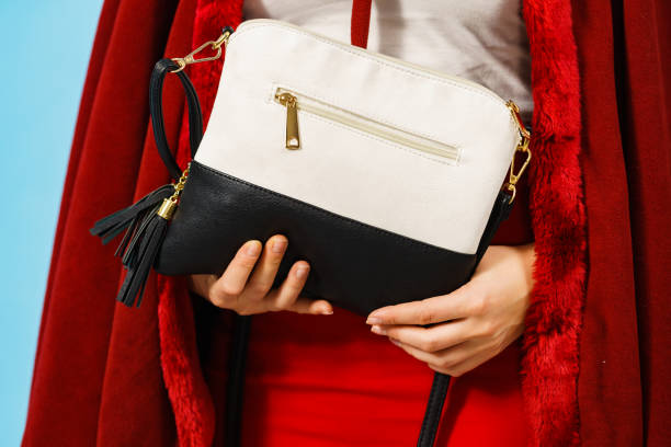 istock Girl holding handbag. 1278247528