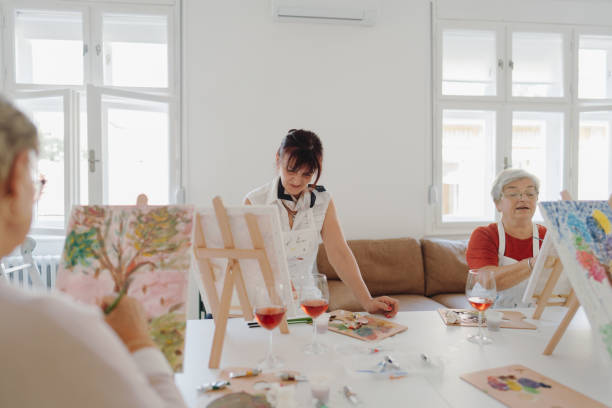 istock Senior women attending a paint and sip class 1278249850
