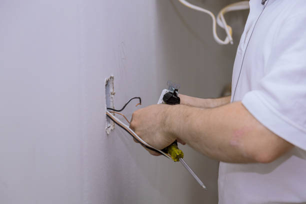 istock Construction in close-up of electricians hand installing outlet on wall with using professional tools. 1278250576