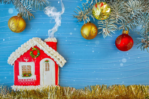 Christmas card with a gingerbread house and toys. stock photo
