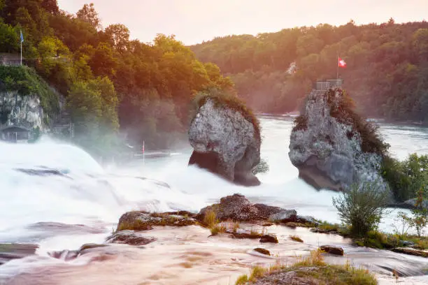 View of Rhine Falls - the biggest waterfall in Europe. Mighty white rapids of the Rhine River at the Rhine Falls, the famous and biggest waterfall in Europe located in Schaffhausen, Switzerland