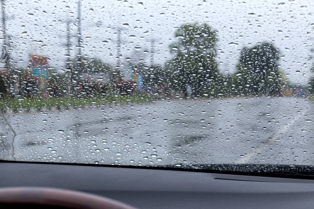 istock Rain drops on the windshield with the road. 1278259333