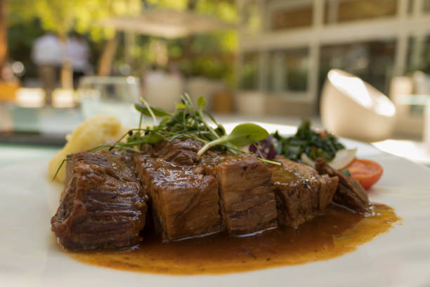 istock Cooked meat, green leaves and mashed potato 1278259575
