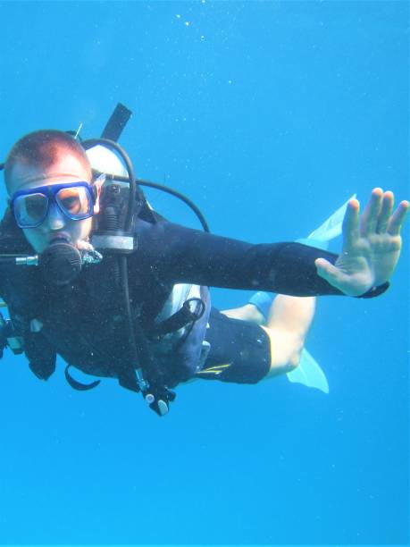 istock Light-skinned man in diving gear is diving underwater. Active lifestyle concept. 1278264612