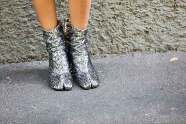 istock September 24, 2020: model wears a pair of silver thong booties 1278266303