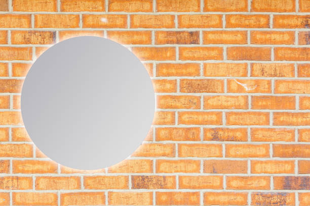 istock Round mirror near brick wall 1278267485
