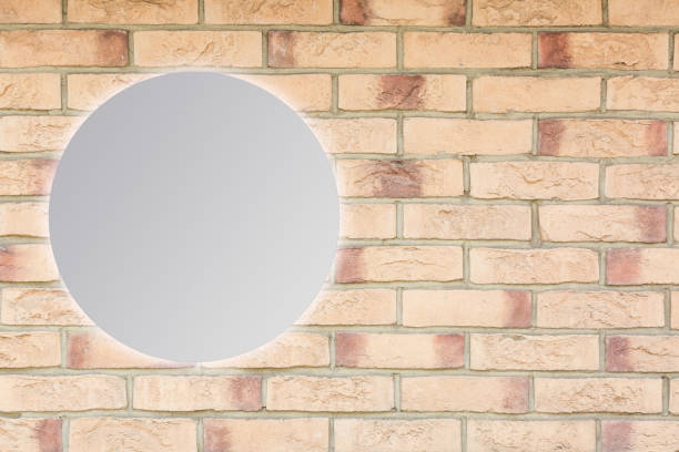 istock Round mirror near brick wall 1278267619