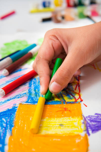 istock Close-up image of hands making drawing and filling colors. 1278267659