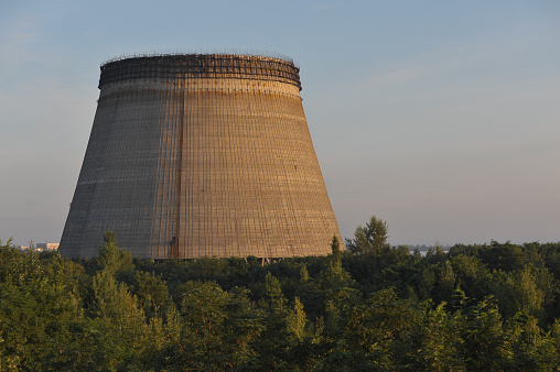 Unfinished cooling tower in Chernobyl zone at morning, summer season, abandoned building of Chernobyl nuclear power plant, Ukraine