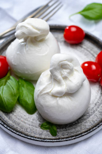 istock Cheese collection, fresh soft white burrata cheese ball made from mozzarella and cream from Apulia, Italy 1278270875