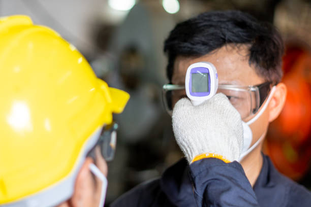 istock Screening measures Prevent the spread of the coronavirus, Factory workers take temperature measurements before working in industrial plants. 1278273864