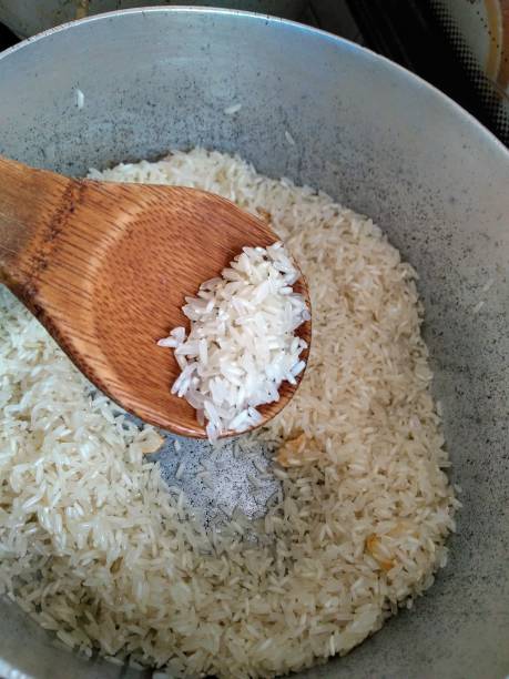 istock Wood spoon on raw rice 1278273944