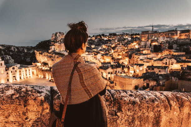 tourist watching the matera panorama of the city tourist watching the matera panorama of the city murge photos stock pictures, royalty-free photos & images