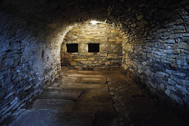 Scary underground, old stony cellar Scary underground, old stony  cellar dungeon medieval prison prison cell stock pictures, royalty-free photos & images