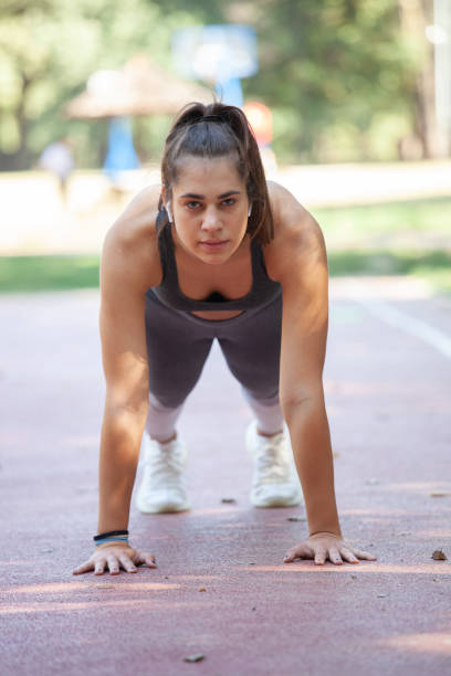 istock Beautiful young woman doing push-ups 1278275362