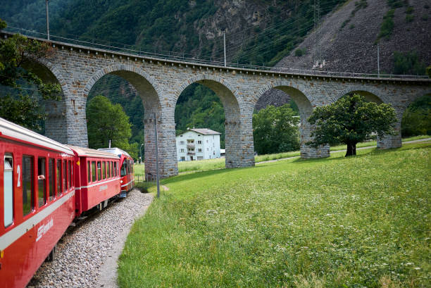 View of Brusio spiral viaduct Brusio, Switzerland - July 21, 2020 : View of Brusio spiral viaduct 1908 stock pictures, royalty-free photos & images