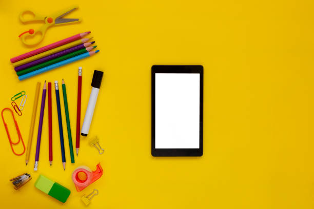 istock School and office supplies with digital tablet on yellow background 1278282115