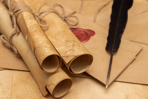 istock Old paper scrolls, pen for writing. Envelope sealed with a seal and jute crepe. Vintage 1278282220