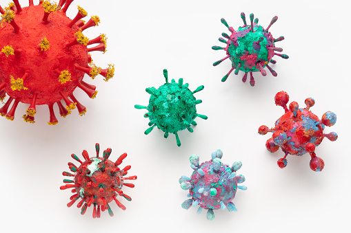 A photograph of a collection of six colorful 3D Virus artwork model forms. Inspired by the Covid-19 lockdown of 2020