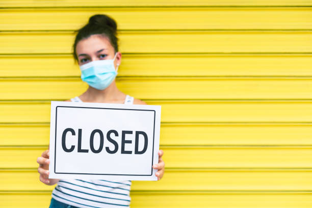 istock Girl with Closed sign 1278283783