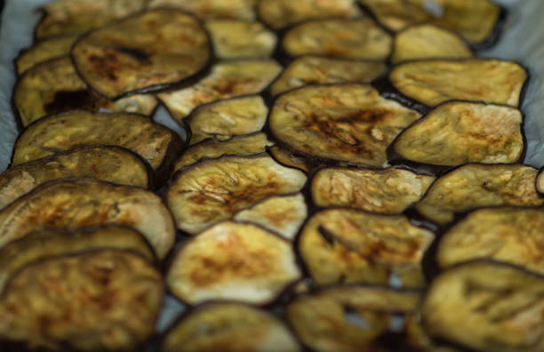 Sliced eggplant on baking paper