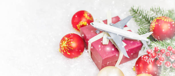 istock Travel for Christmas. Airplane with Christmas decor. Selective focus. 1278286946