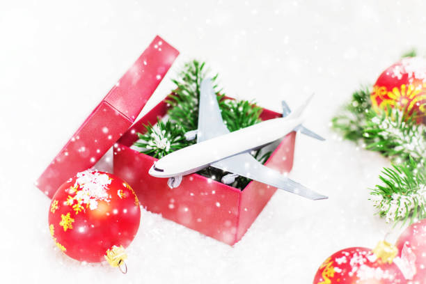 istock Travel for Christmas. Airplane with Christmas decor. Selective focus. 1278286960