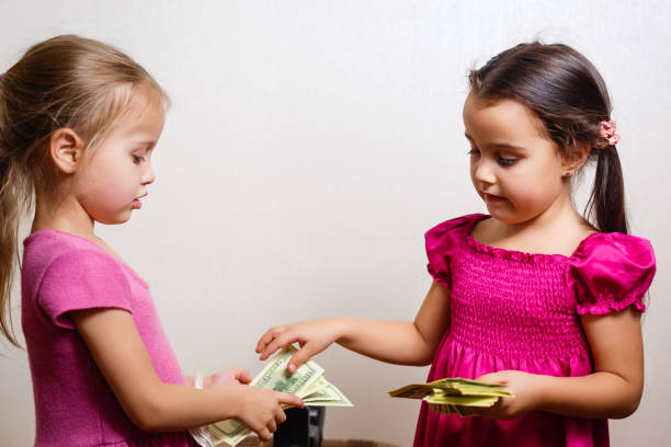 istock Two girls counting their money 1278287160