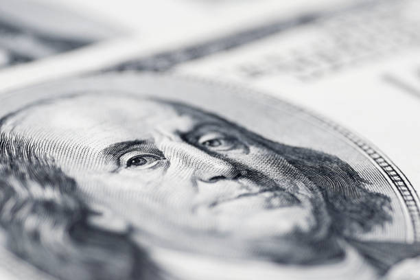istock Benjamin Franklin's eyes from a hundred-dollar bill. The face of Benjamin Franklin on the hundred dollar banknote, backgrounds, close-up. 100 dollar bill with only eyes of Benjamin Franklin 1278288289
