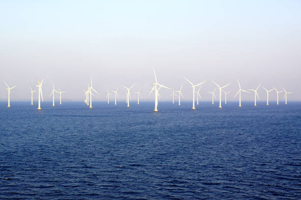 An offshore wind farm South of Malmö, Sweden Several wind farms can be seen off the Southern shore of Sweden, especially along the ferry routes leading to Malmö. floating on water stock pictures, royalty-free photos & images