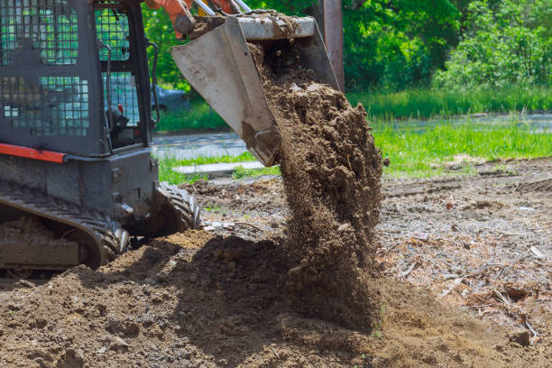 istock Bulldozer moving, leveling ground at construction site 1278294447
