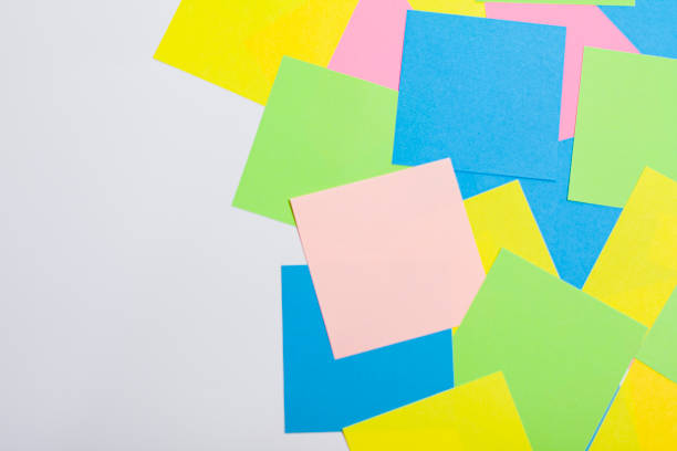 istock Set of office work related rainbow colored paper sticky notes. 1278295509
