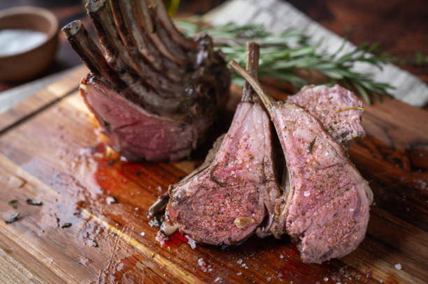 istock roasted lamb rack on wooden cutting board 1278295756