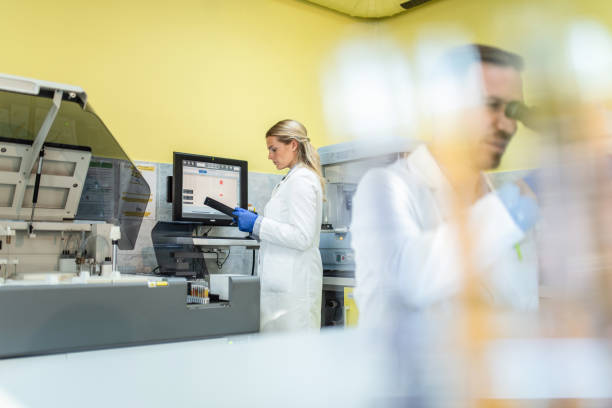 istock Young Female Scientist Working with Blood Samples in Laboratory on Machine. 1278297092