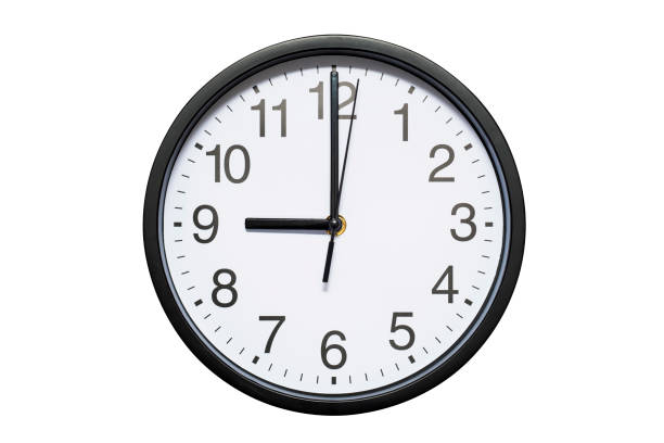 istock Wall clock shows time 9 o'clock on white isolated background. Round wall clock - front view. Twenty one o'clock 1278297470