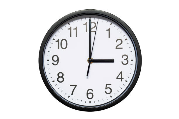 istock Wall clock shows time 3 o'clock on white isolated background. Round wall clock - front view. Fifteen o'clock 1278297473