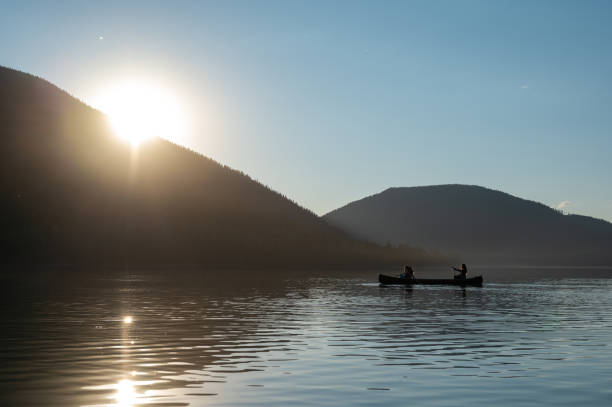 istock Family canoeing on a stunning mountain lake 1278298005