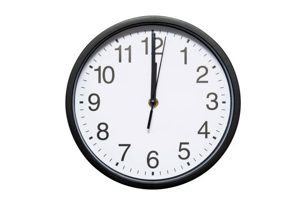 istock Wall clock shows time 12 o'clock on white isolated background. Round wall clock - front view. Twelve o'clock 1278298171