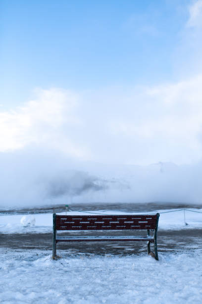 istock Bench for rest overlooking a cloud of steam in winter 1278299283