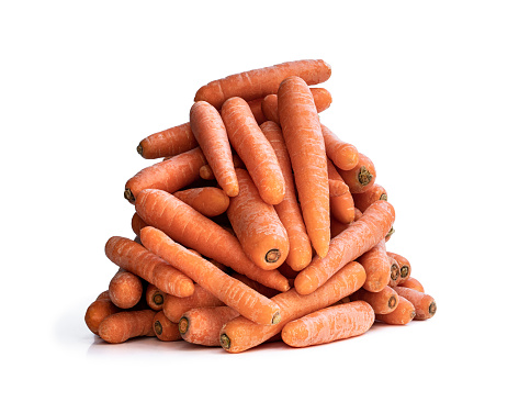 Heap  on fresh carrots isolated on white background