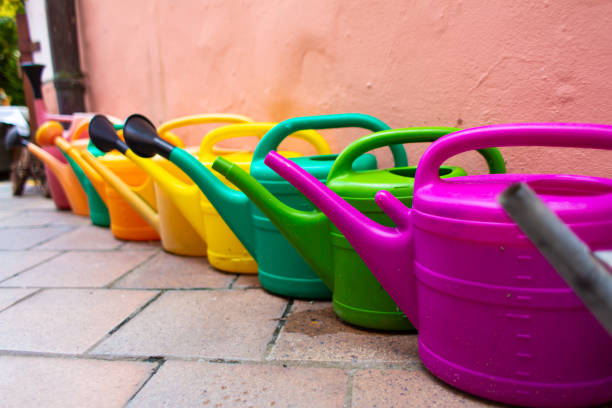 istock Set of multi-colored plastic watering cans for garden care 1278300565
